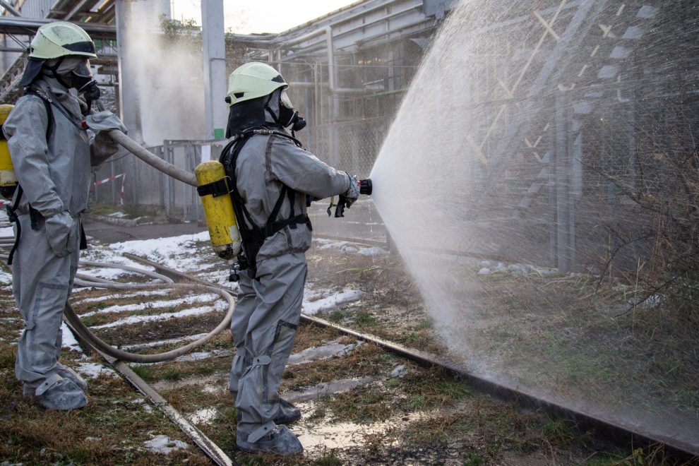 Firefighters in chemical protection suit.