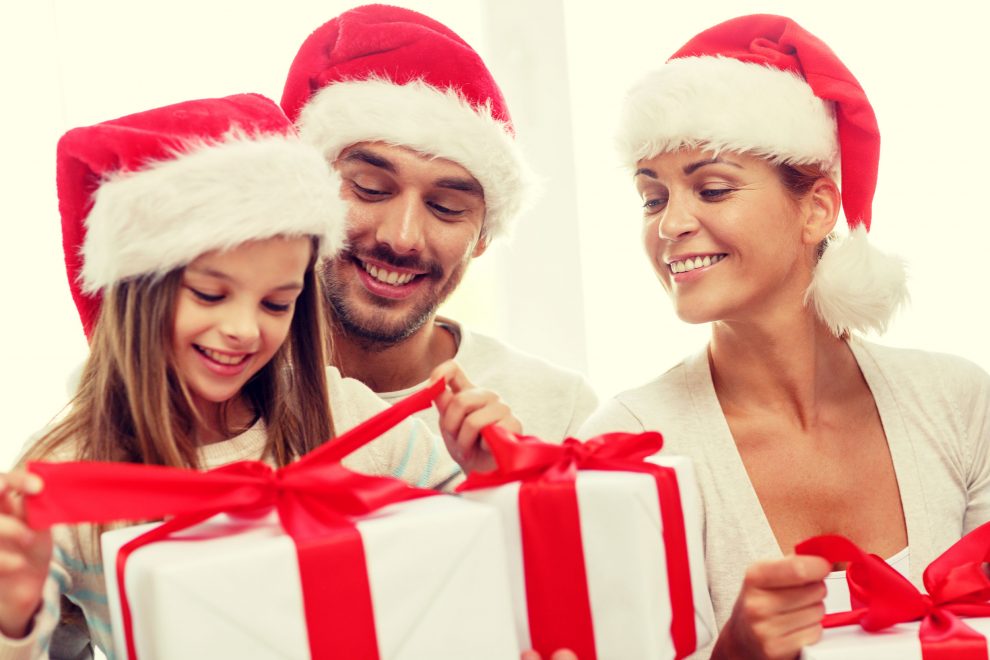 happy family sitting on couch at home