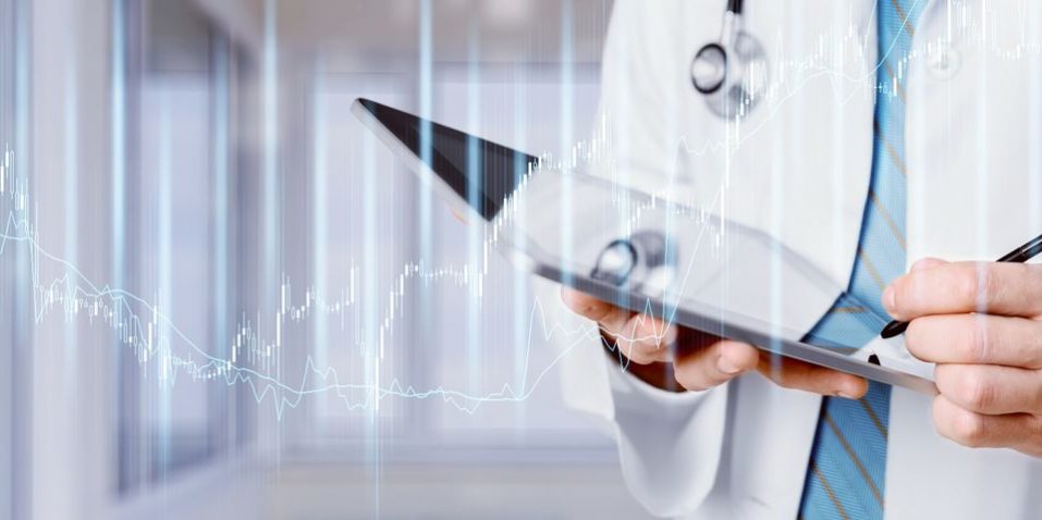 Man doctor using tablet computer in hospital