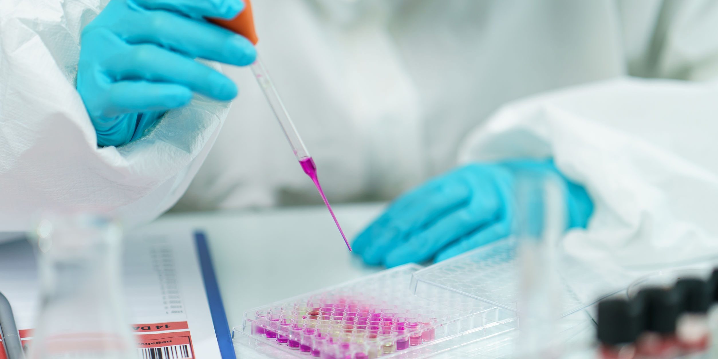 Scientist in laboratory with biological tube for analysis and s