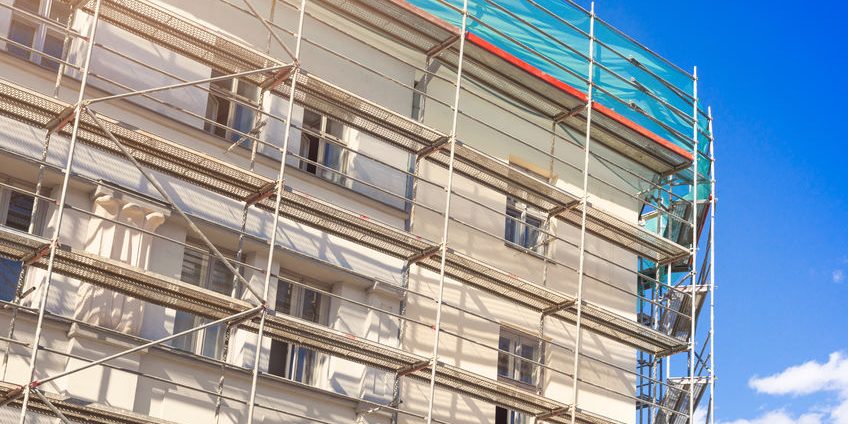 house exterior with scaffold – old town building facade restorat