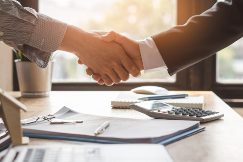 Top,View,Hands,Of,Agent,And,Client,Shaking,Hands,After